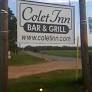 Roadside wooden Colet Inn Bar & Grill sign
